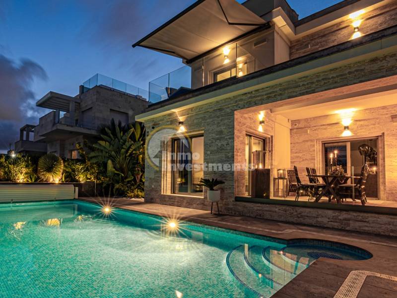 What influences property prices in Orihuela Costa?