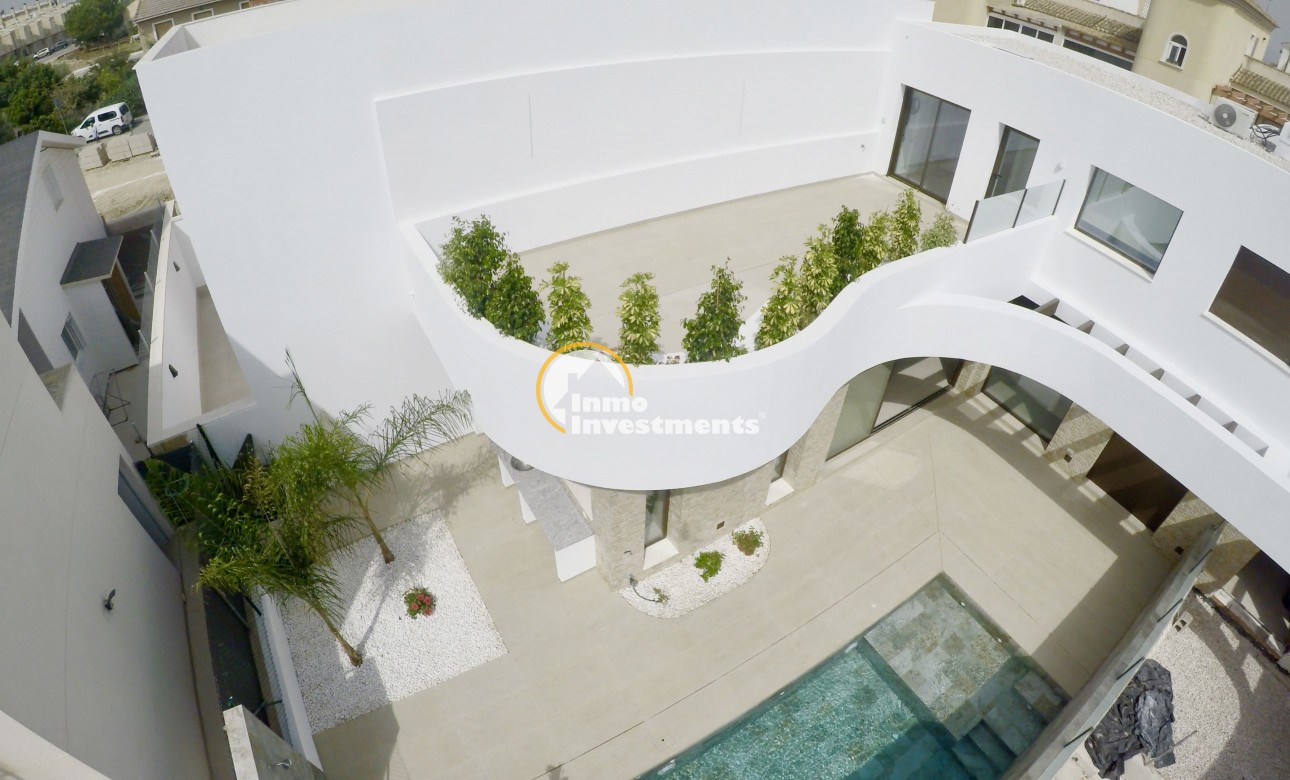 Obra nueva - Chalet adosado - Heredades