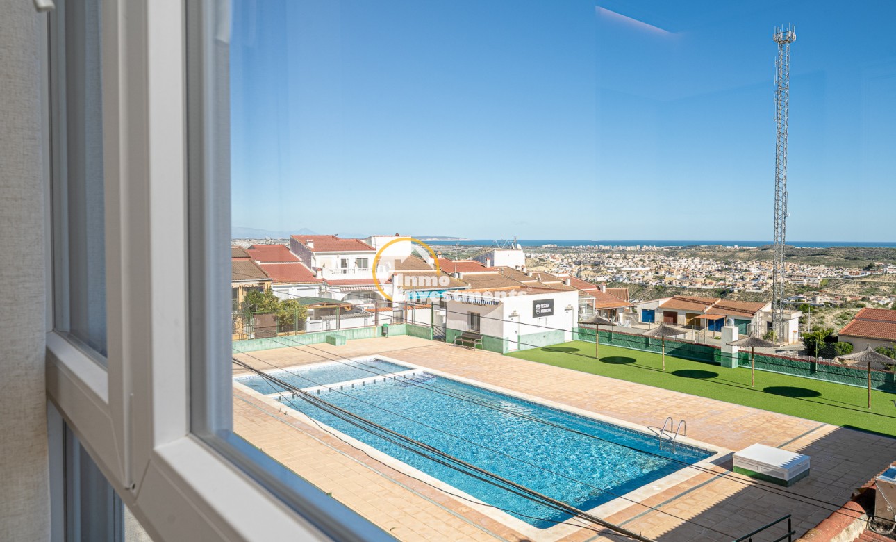 View from apartment window over communal swimming pool and sun terrace in Ciudad Quesada, Spain