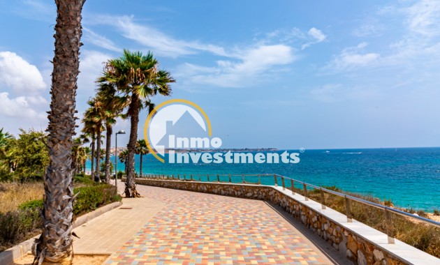 Seafront promenade with palm trees and Mediterranean views near apartment in Mil Palmeras, Spain